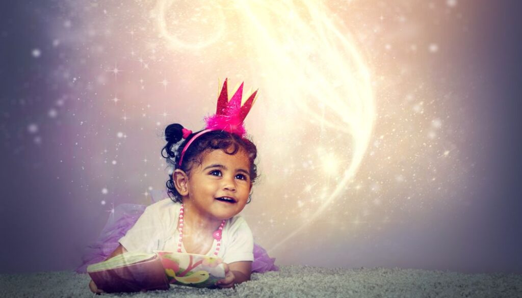 A young girl reading a book with sparkles and magical elements